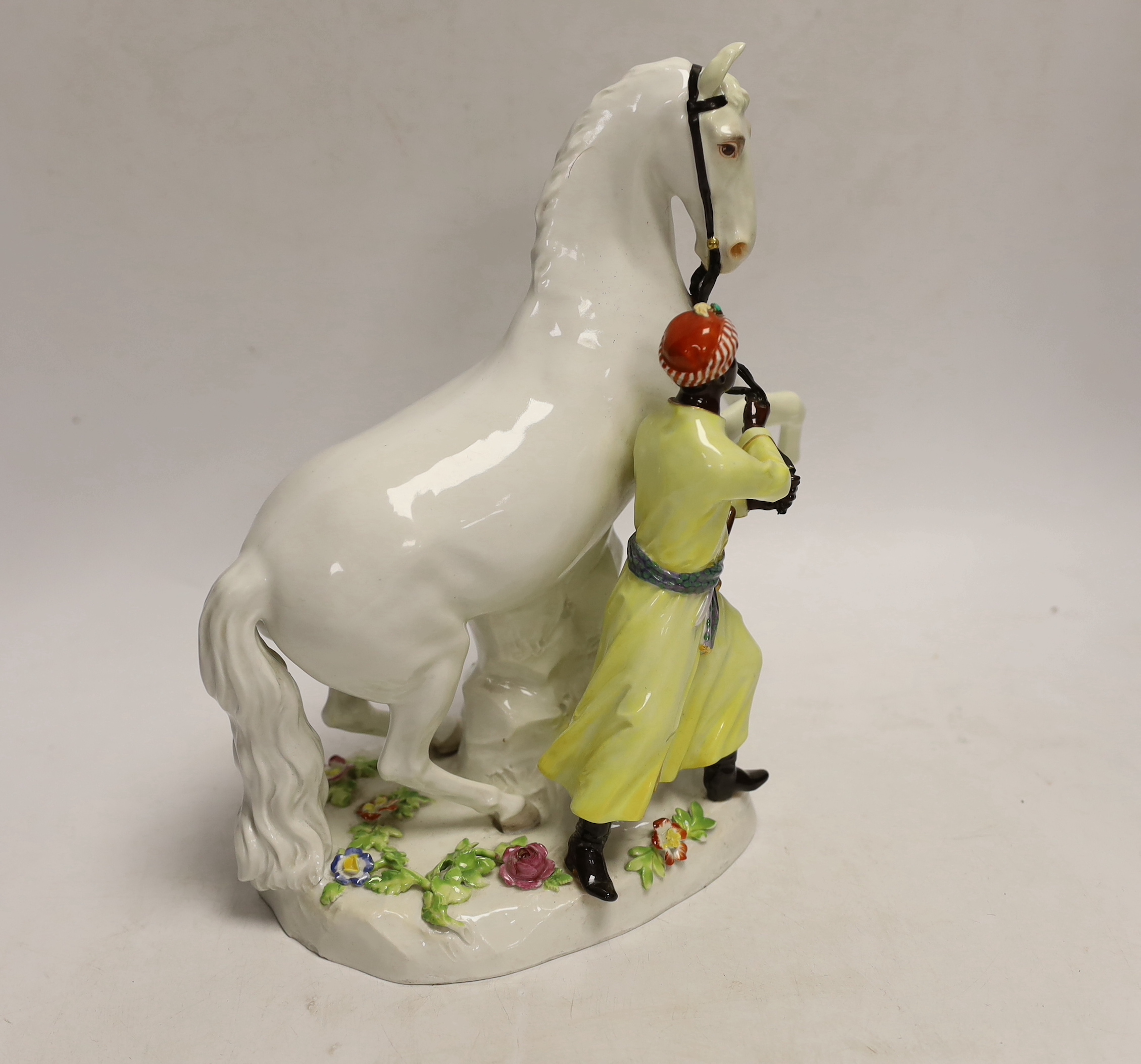 A 19th century Meissen group of a grey horse and groom, 24cm